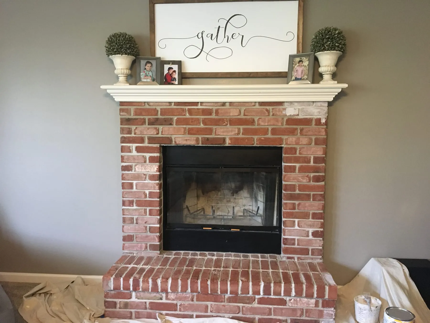 Dated red-brick fireplace before refinishing