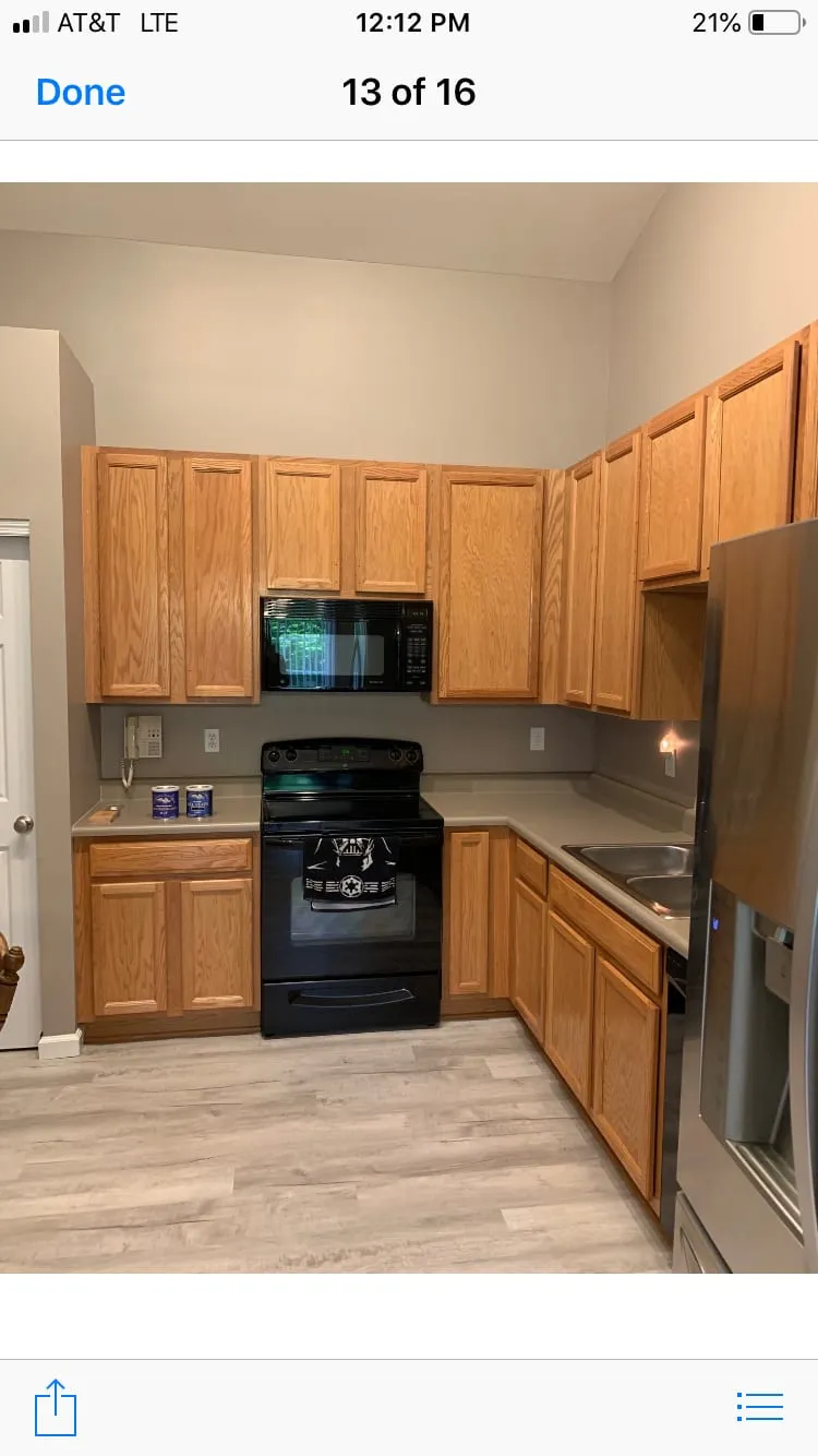 Dated honey-oak kitchen cabinets before