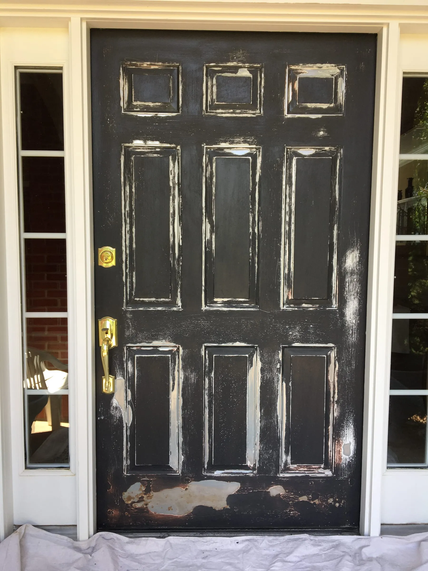 Worn, peeling front door before