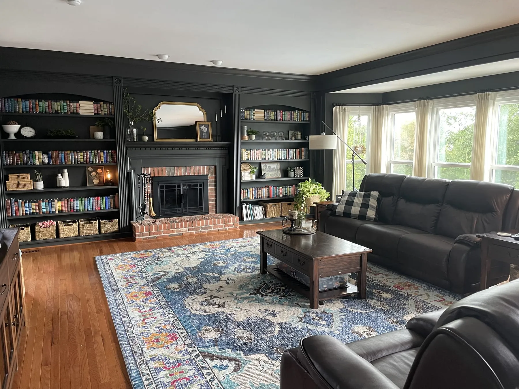 A living room freshly painted in deep charcoal