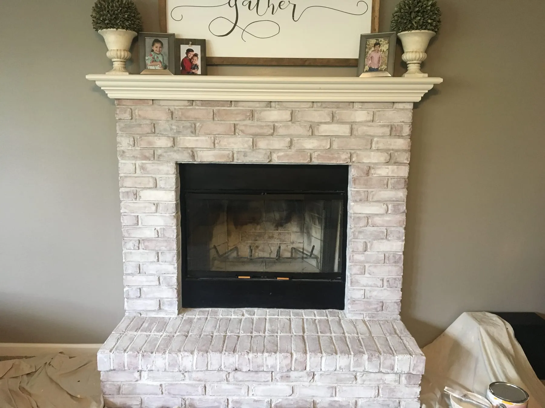 Brick fireplace softened with a light whitewash
